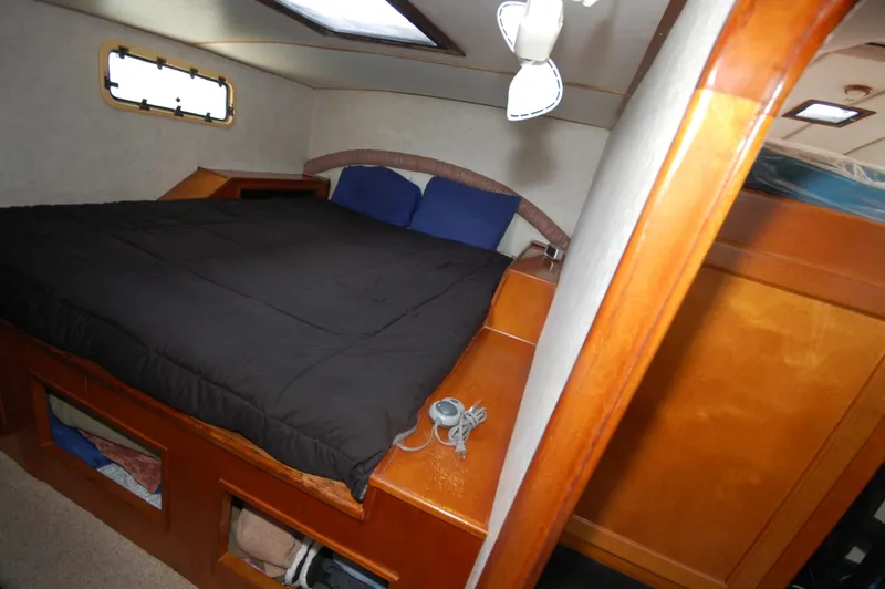 Slide: The Image of Cozy bedroom interior of 2003 Leopard Morrelli & Melvin Catamaran with wooden furnishings. - 19