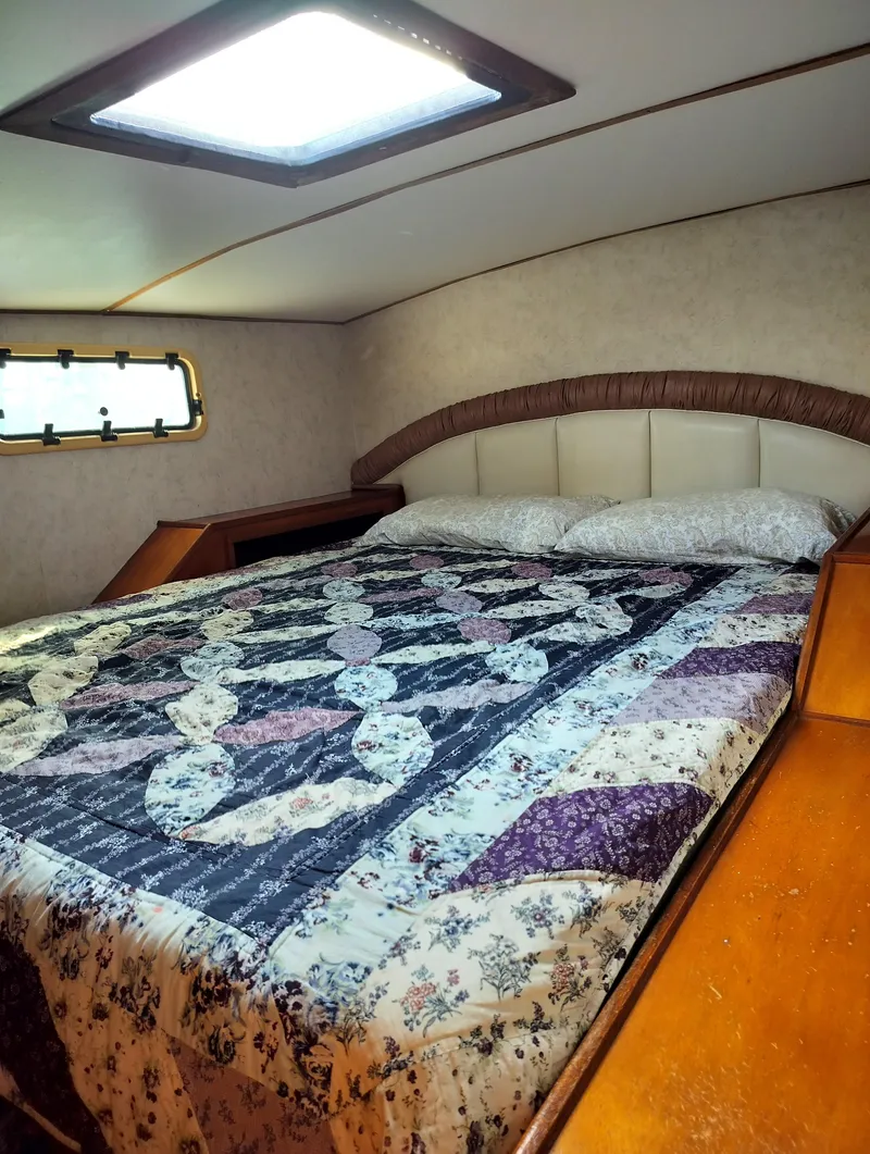 Slide: The Image of Cozy bedroom in 2003 Leopard Morrelli & Melvin Catamaran with quilted bedspread and skylight. - 21