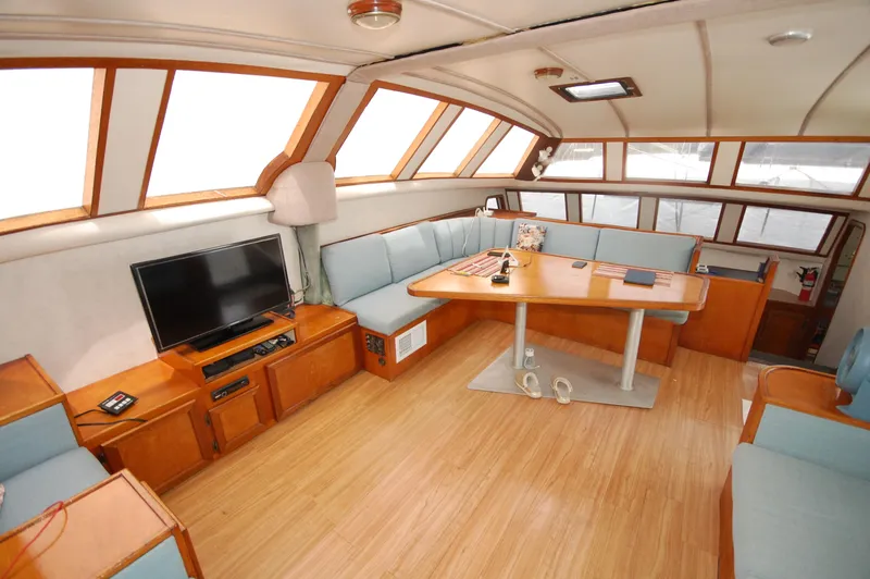 Slide: The Image of Spacious interior of 2003 Leopard Morrelli & Melvin Catamaran with seating, table, and TV. - 3