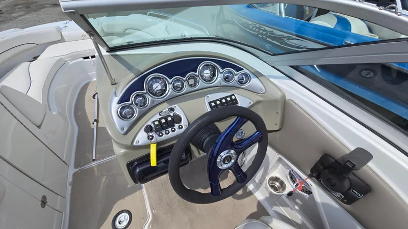 Slide: The Image of 2007 Crownline 220EX boat dashboard with steering wheel and instrument panel. - 16