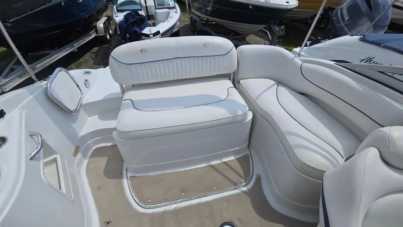 Slide: The Image of 2007 Crownline 220EX boat interior with white seating and spacious layout. - 20