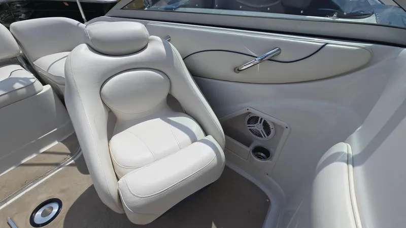 Slide: The Image of 2007 Crownline 220EX boat interior with white leather seating and speaker system. - 21