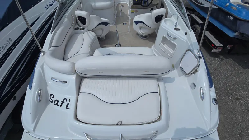 Slide: The Image of 2007 Crownline 220EX boat interior with white seating and steering wheel. - 23