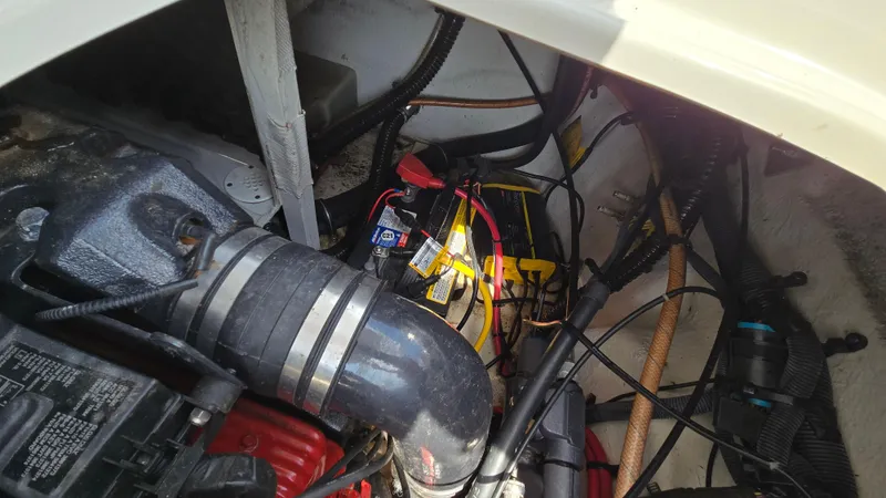 Slide: The Image of Engine compartment of a 2007 Crownline 220EX boat, showing wiring and components. - 45