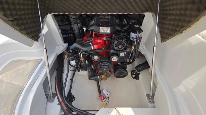 Slide: The Image of Engine compartment of a 2007 Crownline 220EX boat, showcasing detailed mechanical components. - 46