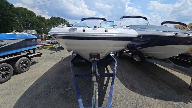 Slide: The Image of 2007 Crownline 220EX boat on trailer under a cloudy sky. - 7