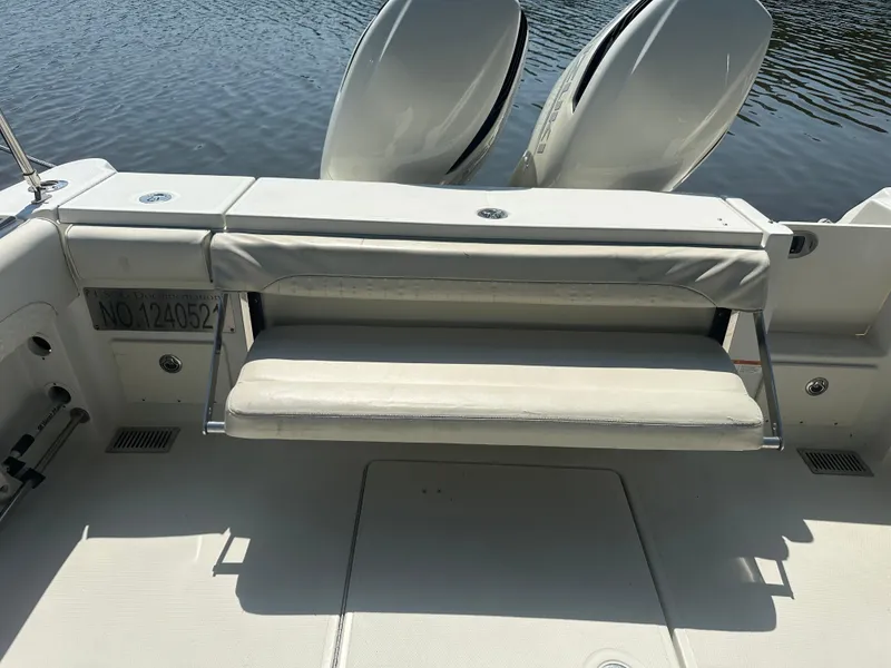 Slide: The Image of 2006 Hydra-Sports Vector 2900 VX boat with cushioned seating and twin outboard motors. - 15