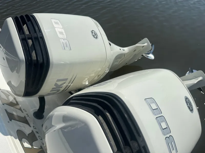 Slide: The Image of Twin Suzuki 300 outboard engines on a 2006 Hydra-Sports Vector 2900 VX boat. - 16