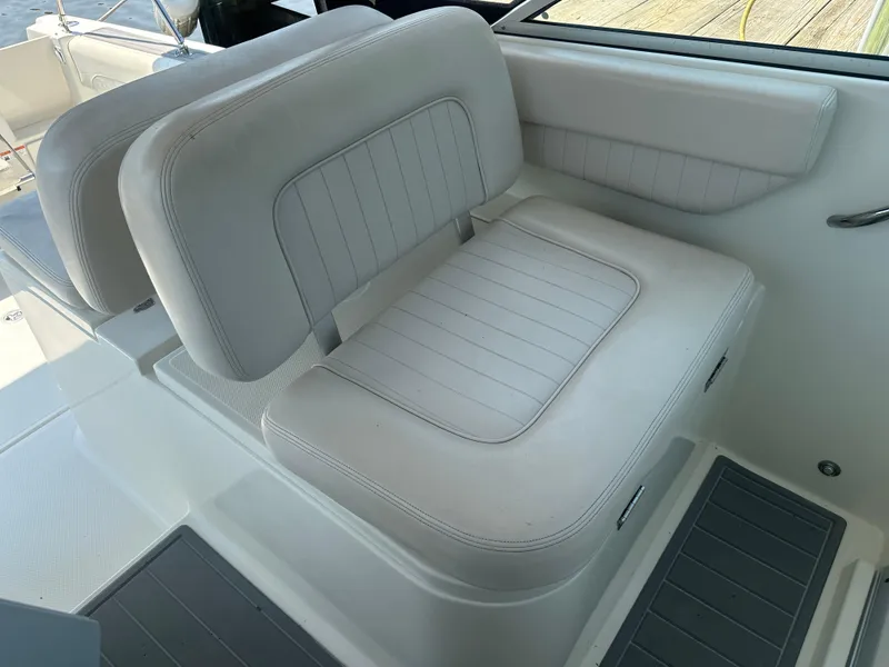Slide: The Image of 2006 Hydra-Sports Vector 2900 VX boat seating, featuring white cushioned seats and sleek design. - 24