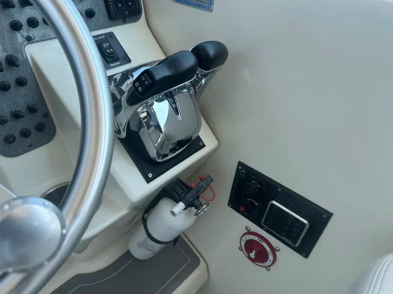 Slide: The Image of 2006 Hydra-Sports Vector 2900 VX boat controls and steering wheel. - 26
