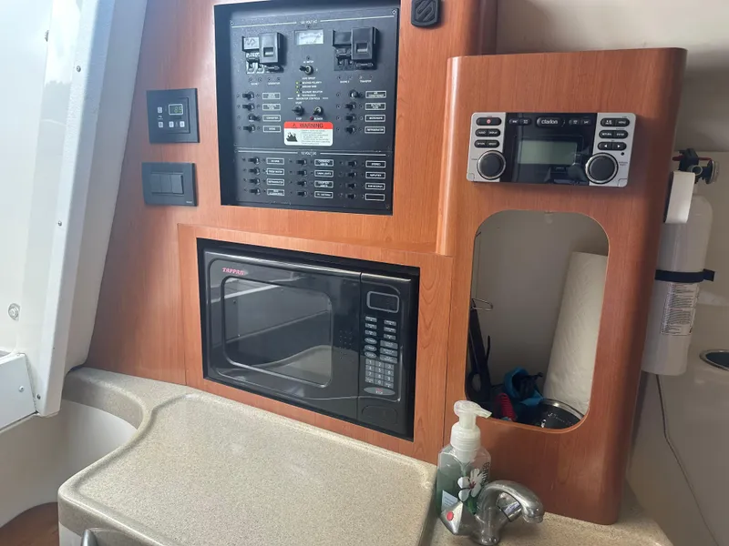 Slide: The Image of 2006 Hydra-Sports Vector 2900 VX cabin with control panel, microwave, and sink. - 31