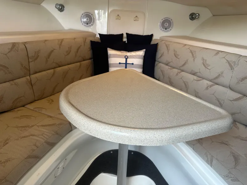 Slide: The Image of 2006 Hydra-Sports Vector 2900 VX cabin interior with cushioned seating and table. - 36