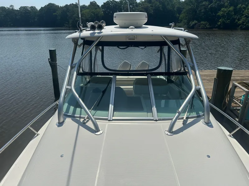 Slide: The Image of 2006 Hydra-Sports Vector 2900 VX boat docked by a serene lake. - 38