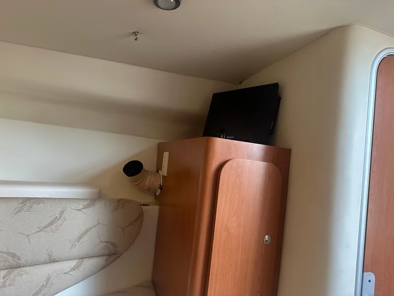Slide: The Image of Interior of 2006 Hydra-Sports Vector 2900 VX with TV and wooden cabinet. - 39