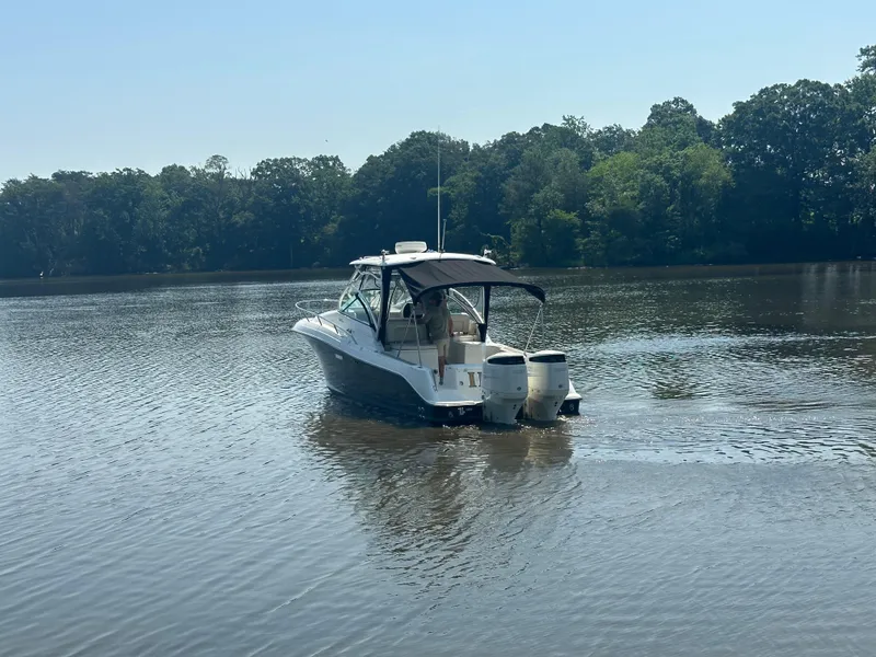Slide: The Image of 2006 Hydra-Sports Vector 2900 VX boat on calm lake with forested background. - 4