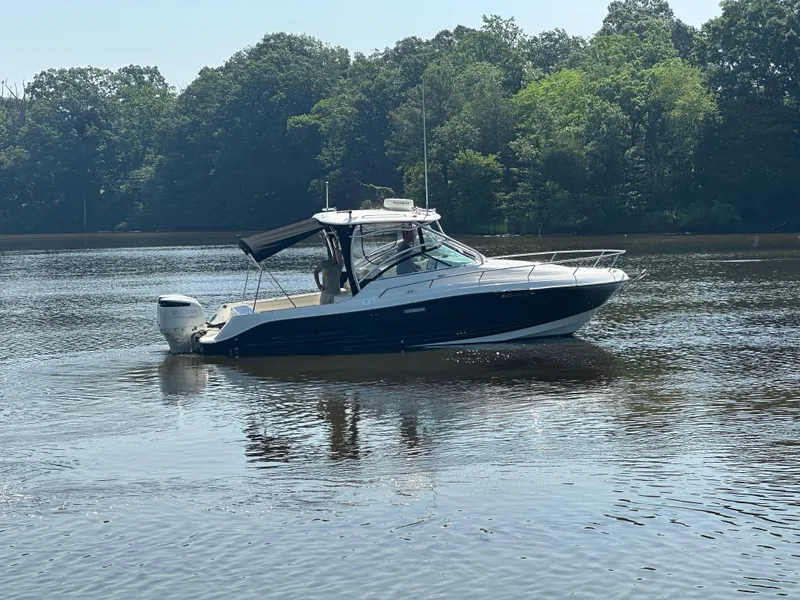 Slide: The Image of 2006 Hydra-Sports Vector 2900 VX boat on calm water with forested background. - 5