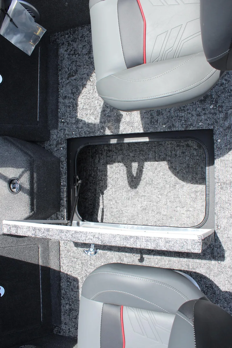 Slide: The Image of 2025 Tracker Pro Guide V-175 Combo interior with gray seats and storage compartment. - 22