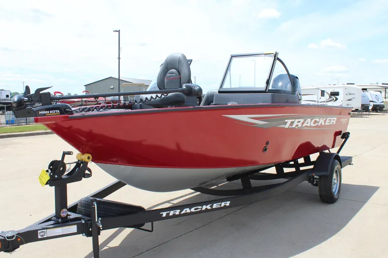 Slide: The Image of 2025 Tracker Pro Guide V-175 Combo boat in red on trailer, outdoor display. - 3