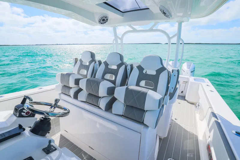 Slide: The Image of Luxurious 2025 Blackwater 43 Sportfish boat interior with plush seating on turquoise waters. - 21
