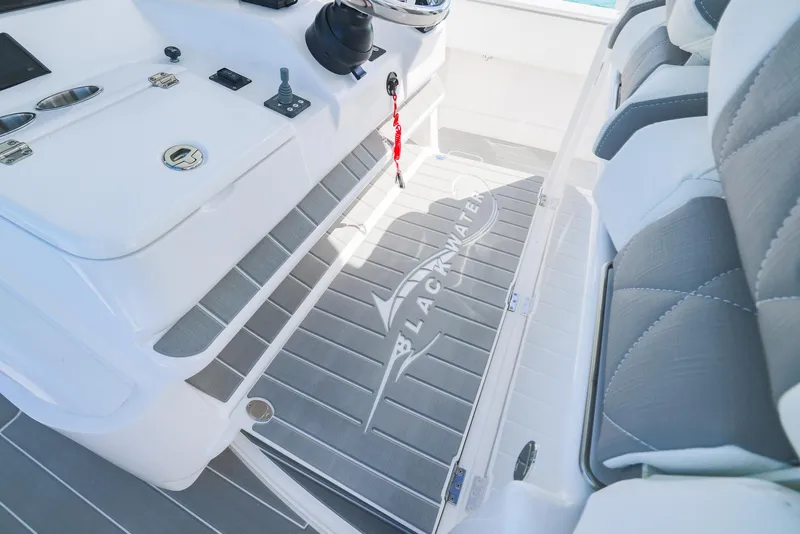 Slide: The Image of Interior of 2025 Blackwater 43 Sportfish boat with sleek seating and control panel. - 25