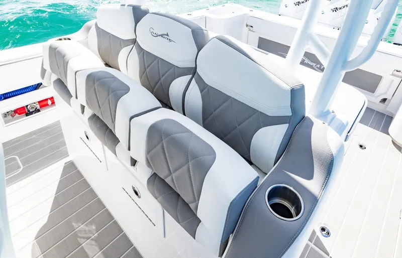 Slide: The Image of Luxurious seating on 2025 Blackwater 43 Sportfish boat with cup holder, gray and white design. - 27
