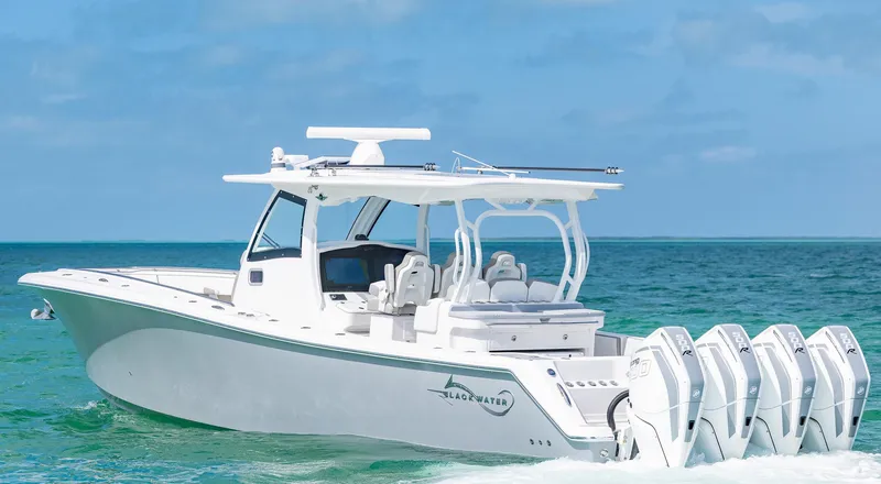 Slide: The Image of 2025 Blackwater 43 Sportfish boat cruising on clear blue ocean waters. - 3