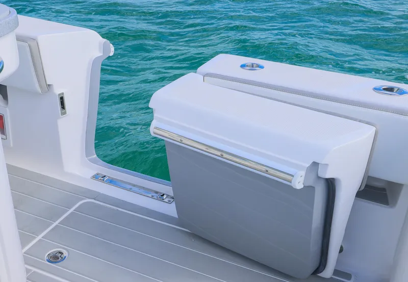 Slide: The Image of 2025 Blackwater 43 Sportfish boat with foldable seat, overlooking clear blue water. - 37