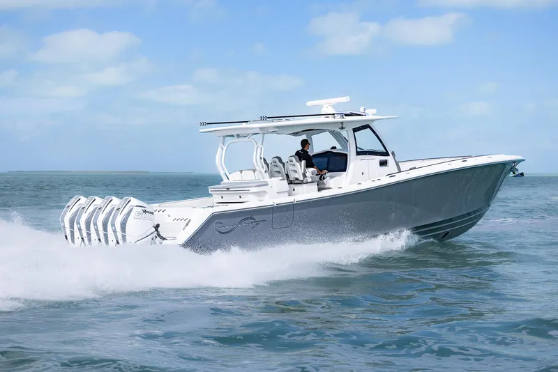 Slide: The Image of 2025 Blackwater 43 Sportfish boat cruising on open water, showcasing sleek design and powerful engines. - 40