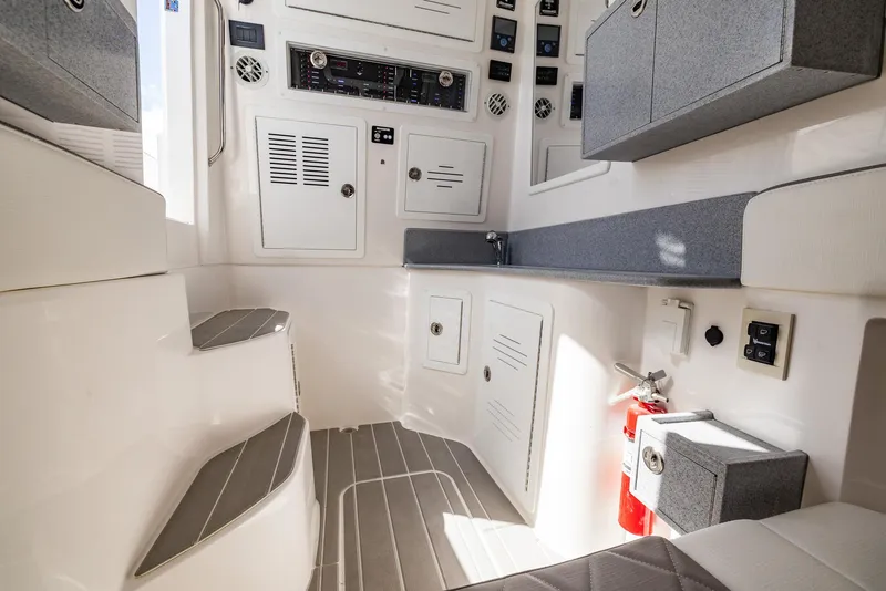 Slide: The Image of Interior of 2025 Blackwater 43 Sportfish boat, featuring modern controls and seating. - 41