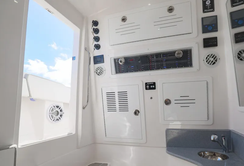 Slide: The Image of Interior of 2025 Blackwater 43 Sportfish boat with control panels and sink. - 44
