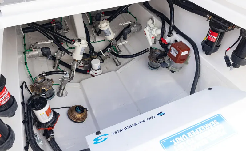 Slide: The Image of Engine compartment of 2025 Blackwater 43 Sportfish with visible wiring and components. - 48