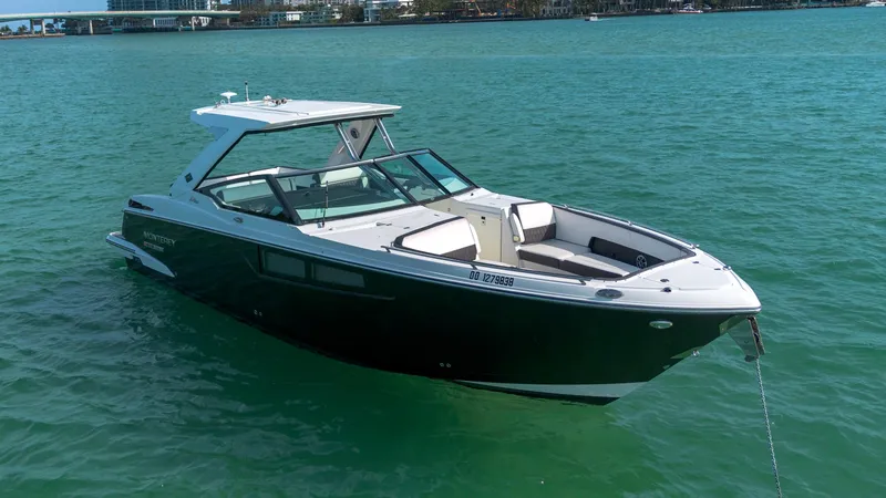 The Image of 2018 Monterey 378 Super Express boat anchored on calm blue water. - 0