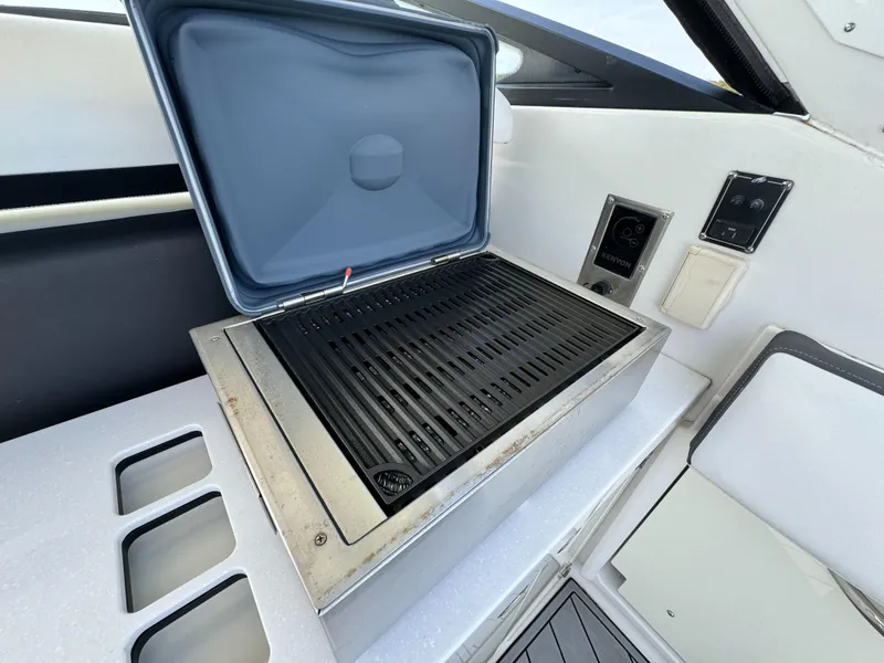 Slide: The Image of Built-in grill on 2018 Monterey 378 Super Express yacht, featuring sleek design and modern controls. - 10