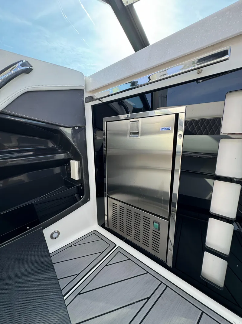 Slide: The Image of Interior of 2018 Monterey 378 Super Express boat with stainless steel refrigerator. - 12