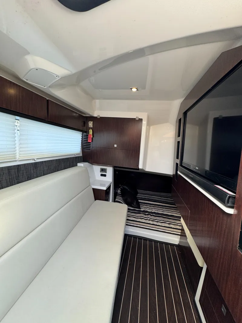 Slide: The Image of Interior of 2018 Monterey 378 Super Express yacht with modern seating and entertainment system. - 22