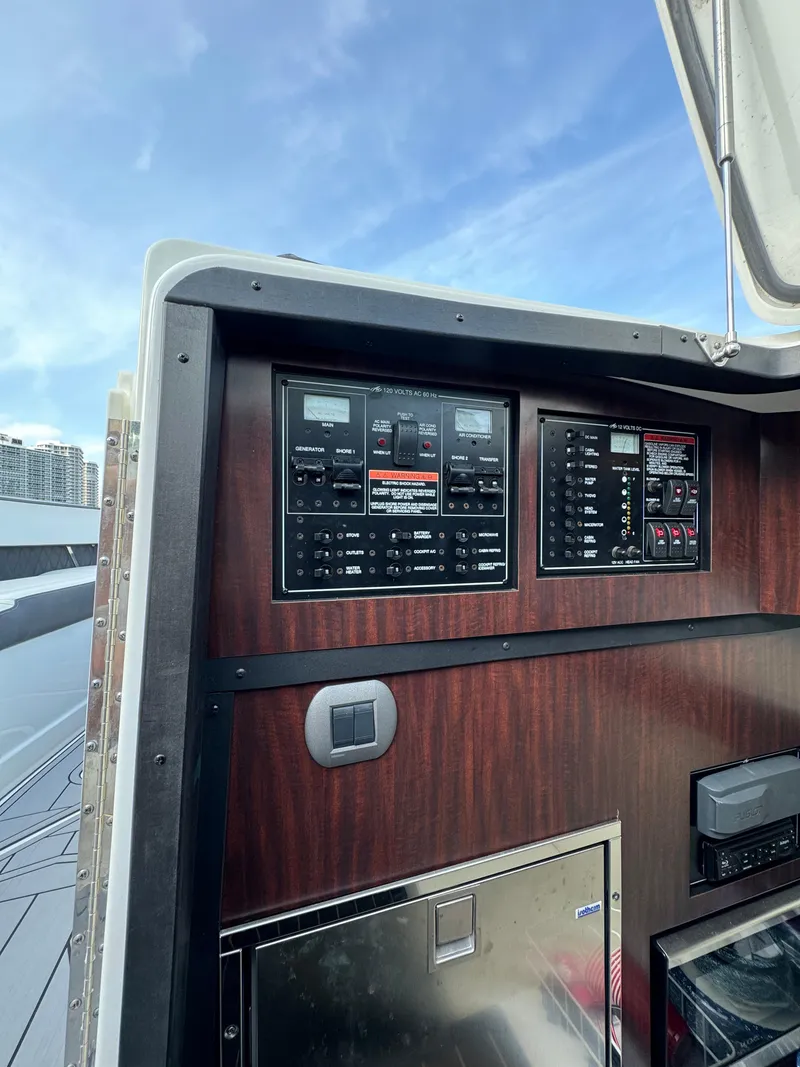Slide: The Image of Control panel of a 2018 Monterey 378 Super Express boat with wood finish. - 25