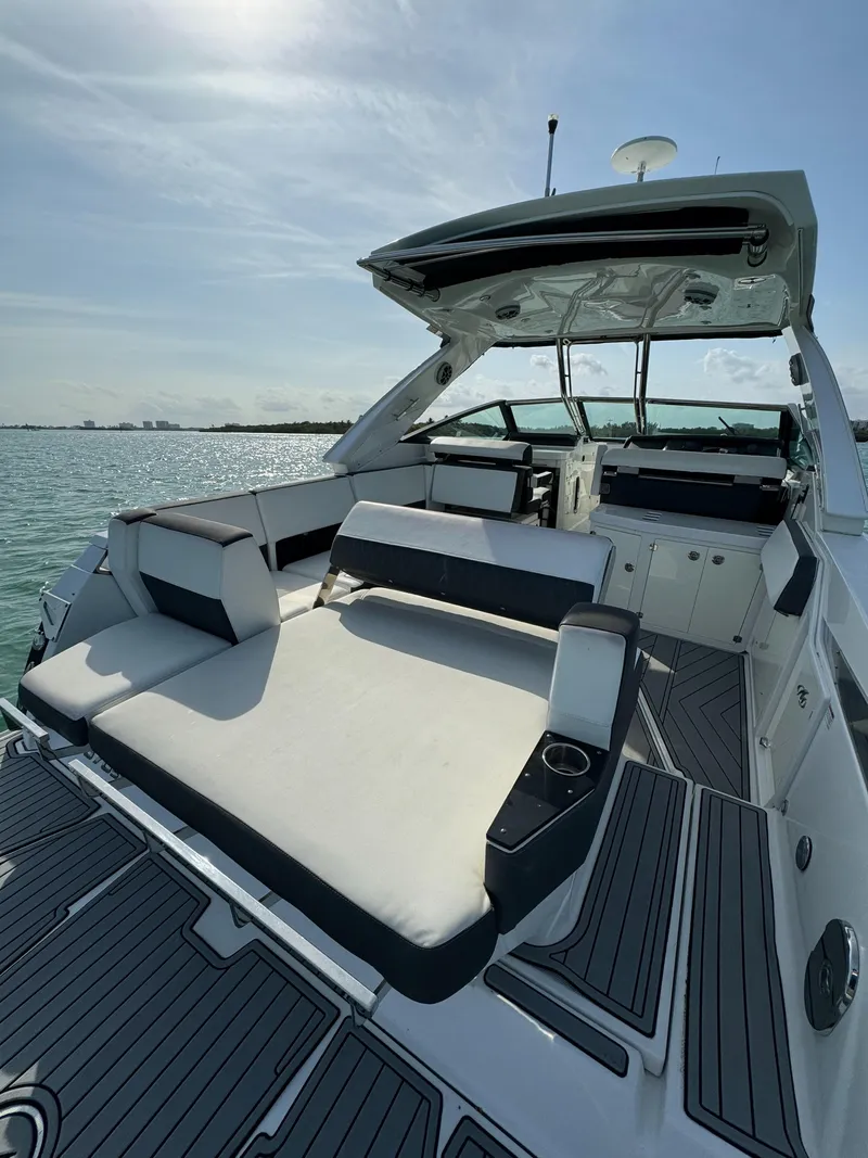 Slide: The Image of 2018 Monterey 378 Super Express yacht interior with luxurious seating and ocean view. - 6