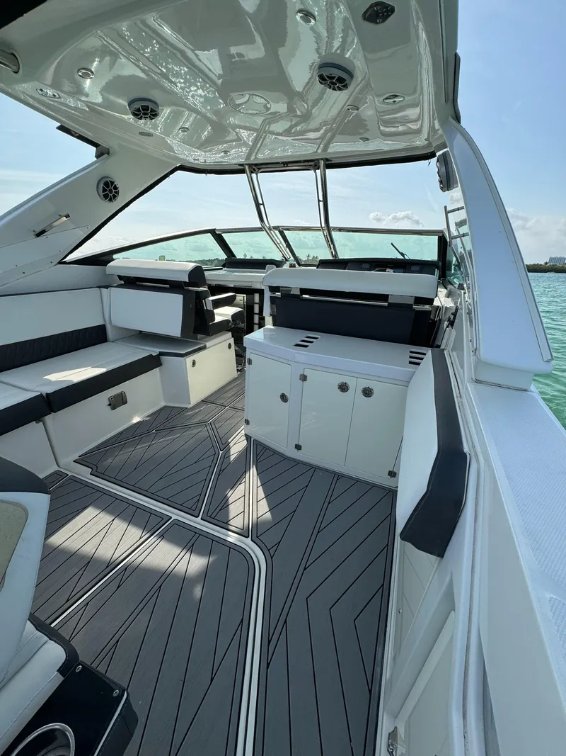 Slide: The Image of 2018 Monterey 378 Super Express boat interior with sleek seating and modern design. - 7