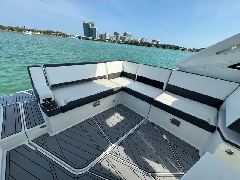 Slide: The Image of Luxurious seating on 2018 Monterey 378 Super Express yacht with scenic waterfront view. - 8