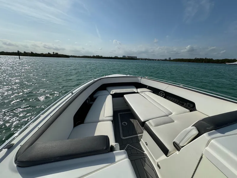 Slide: The Image of Luxurious 2018 Monterey 378 Super Express boat interior with comfortable seating on a sunny day. - 15