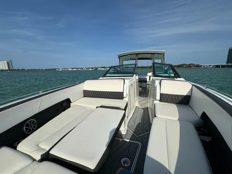 Slide: The Image of 2018 Monterey 378 Super Express boat interior with luxurious seating on a sunny day. - 17