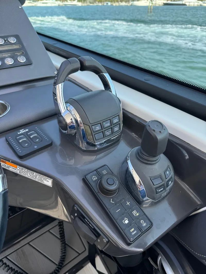 Slide: The Image of Control panel of 2018 Monterey 378 Super Express boat with throttle and joystick. - 20