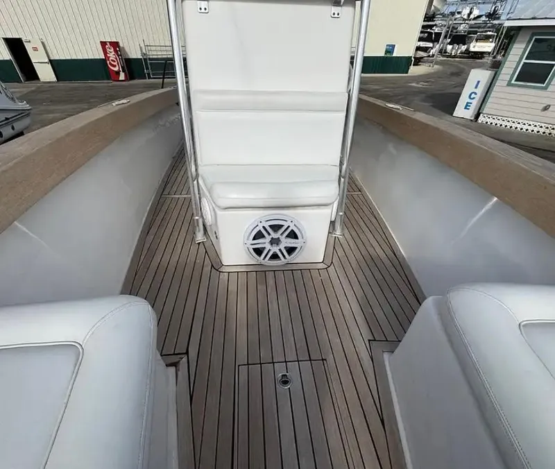 Slide: The Image of 2007 Buddy Davis 31 Custom boat interior with cushioned seating and wooden deck. - 10