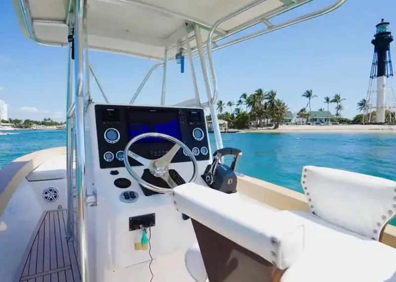 Slide: The Image of 2007 Buddy Davis 31 Custom boat with wooden deck and cushioned seating. - 14