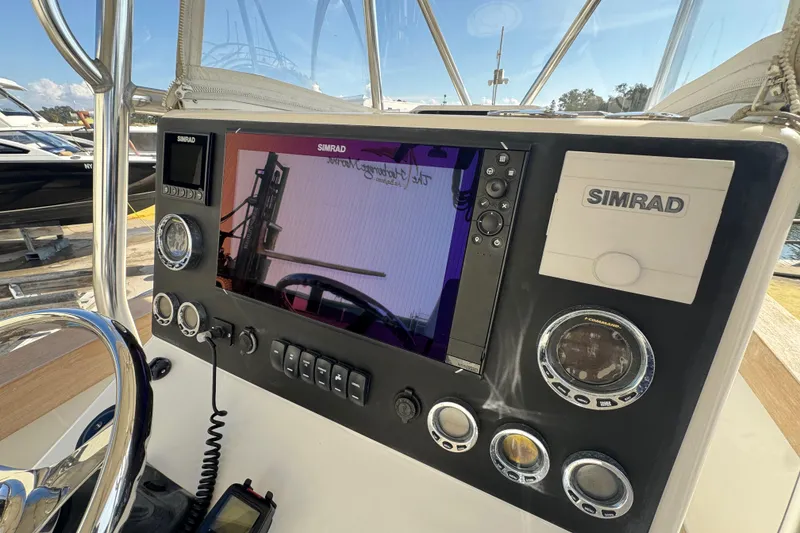 Slide: The Image of Control panel of a 2007 Buddy Davis 31 Custom boat with Simrad electronics. - 15