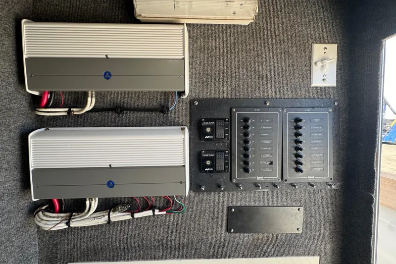 Slide: The Image of Electrical panel and wiring inside a 2007 Buddy Davis 31 Custom boat. - 18