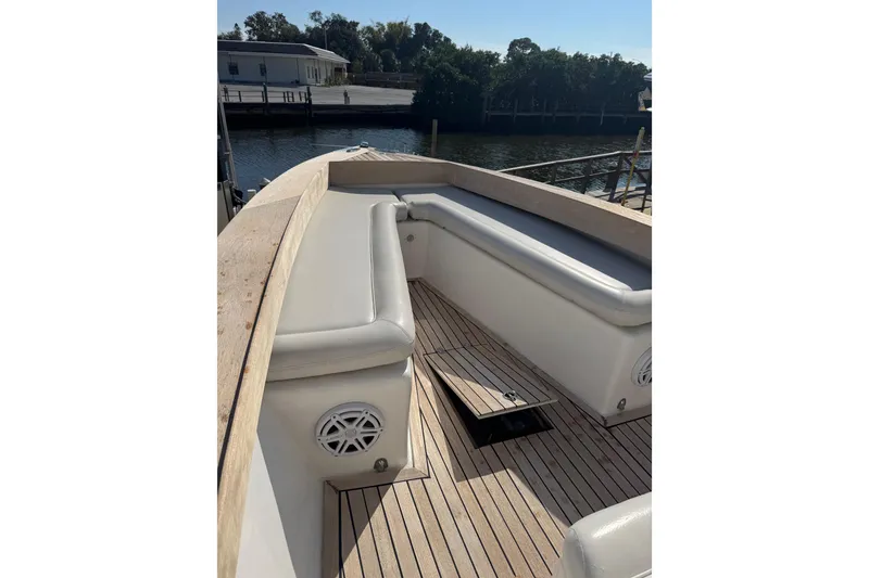 Slide: The Image of 2007 Buddy Davis 31 Custom boat with cushioned seating and wooden deck. - 21