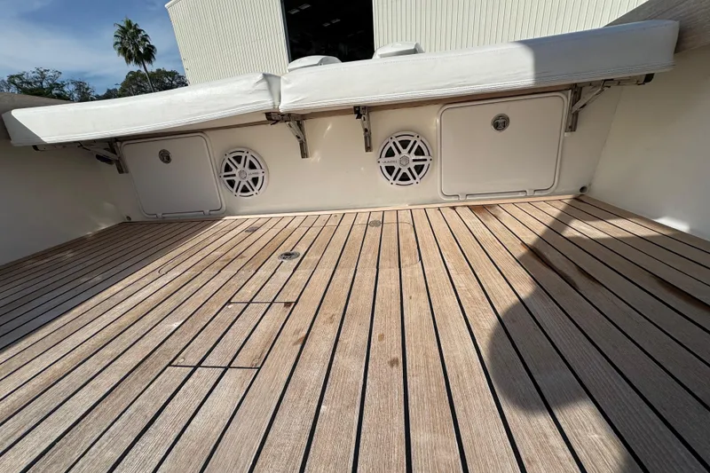Slide: The Image of 2007 Buddy Davis 31 Custom boat deck with teak flooring and storage compartments. - 24