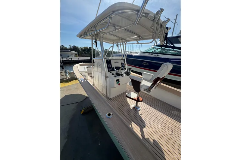 Slide: The Image of 2007 Buddy Davis 31 Custom boat with helm station and seating, docked at marina. - 29