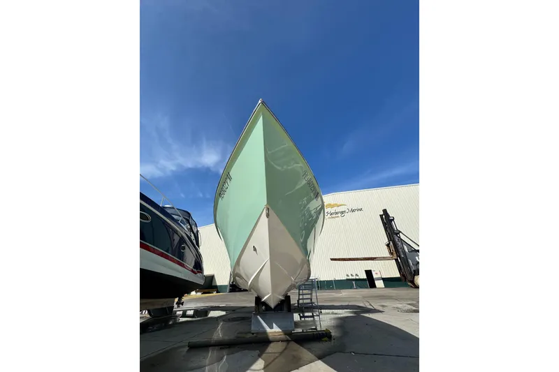 Slide: The Image of 2007 Buddy Davis 31 Custom boat on display under clear blue sky. - 38